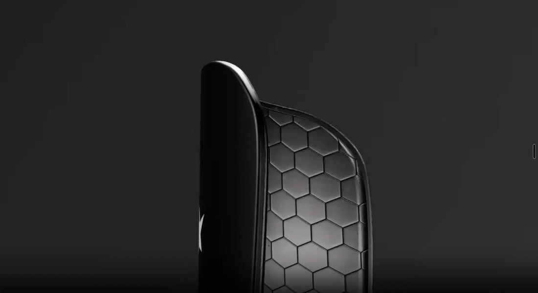 Shinplex™ mouldable shin pad on a footballer's shin