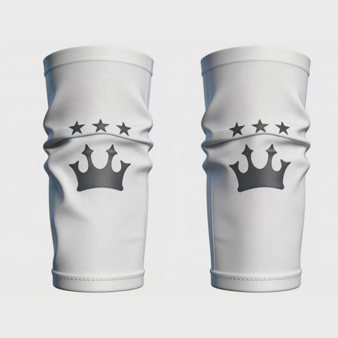 Pair of white Shinplex shin guard compression sleeves with crown logo
